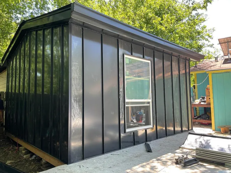 Black standing seam metal wall panels for Metal Roof Installation in Lockwood